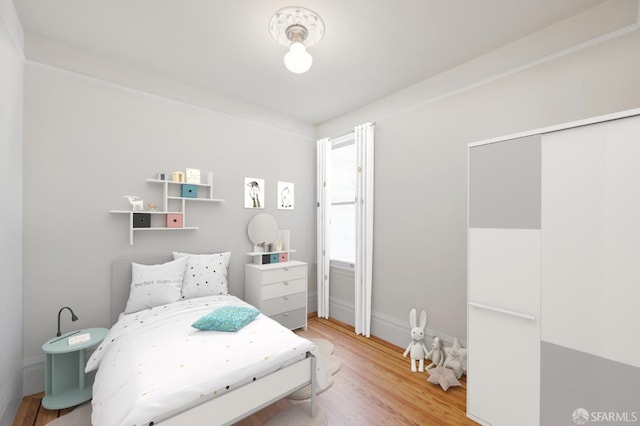 bedroom featuring light wood finished floors