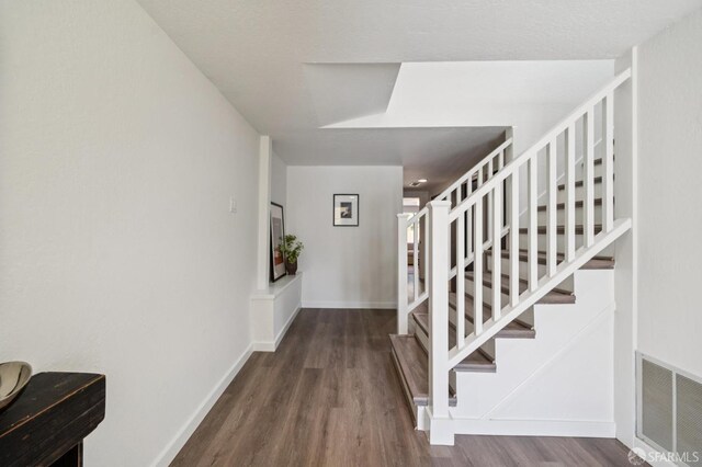 363 Prague St, San Francisco, CA 94112 - entrance foyer with wood finished floors and stairs