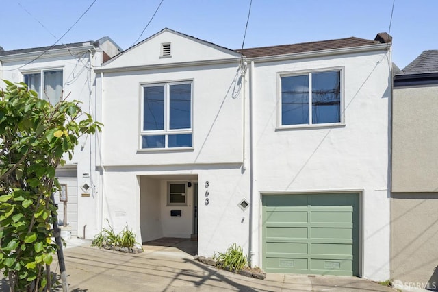 363 Prague St, San Francisco, CA 94112 - view of front of property featuring stucco siding and an attached garage