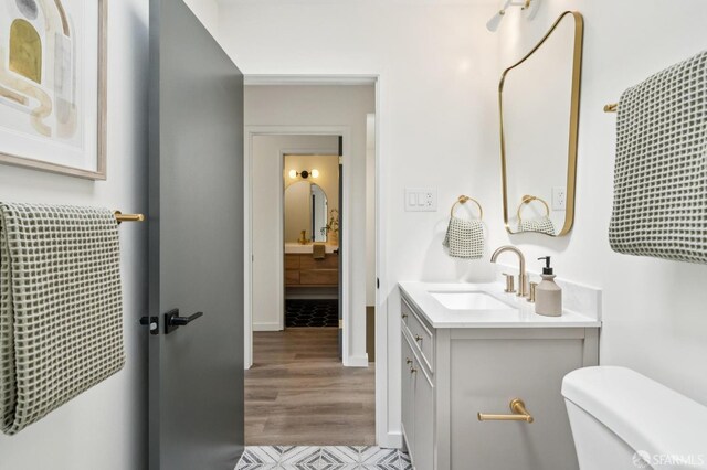 363 Prague St, San Francisco, CA 94112 - bathroom featuring vanity and wood finished floors