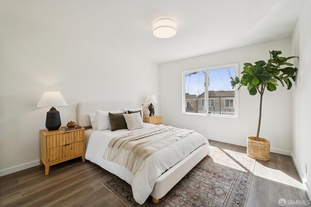 363 Prague St, San Francisco, CA 94112 - bedroom with dark wood-style floors and baseboards