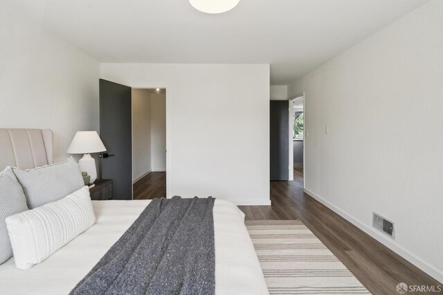 363 Prague St, San Francisco, CA 94112 - bedroom featuring wood finished floors and baseboards