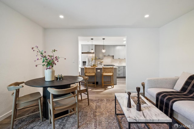 363 Prague St, San Francisco, CA 94112 - living area featuring wood finished floors and recessed lighting