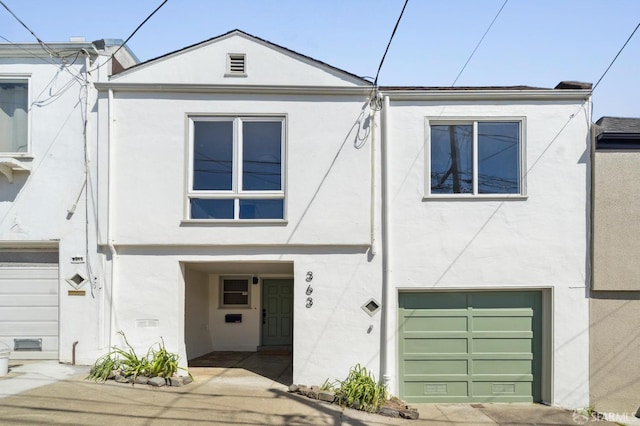 363 Prague St, San Francisco, CA 94112 - view of front facade featuring stucco siding and a garage