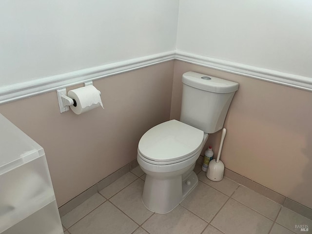 bathroom featuring toilet and tile patterned floors