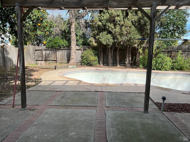 view of pool with a fenced in pool, a patio area, and a fenced backyard