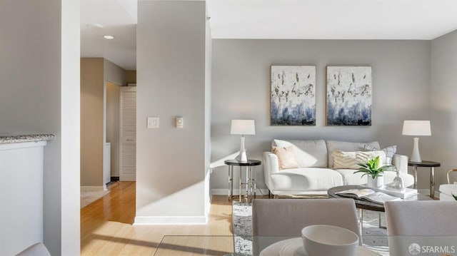 living room featuring wood finished floors and baseboards