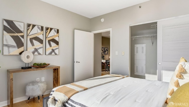 bedroom with a closet and wood finished floors