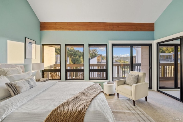 bedroom featuring light colored carpet, lofted ceiling, and access to outside