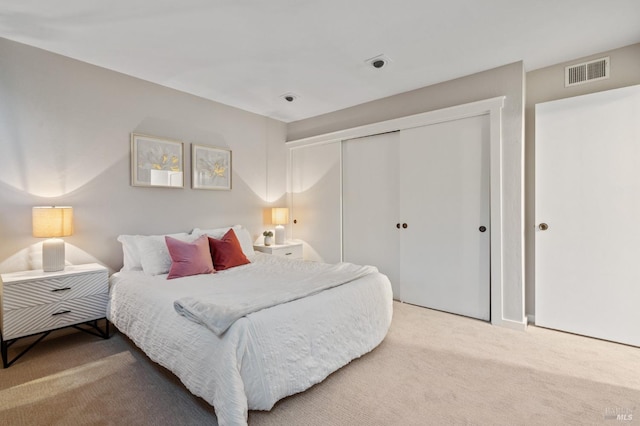 bedroom with carpet flooring and a closet