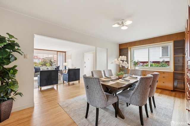 1285 Holloway Ave, San Francisco, CA 94132 - dining space featuring light wood-style floors and a chandelier