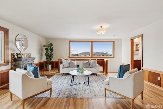 1285 Holloway Ave, San Francisco, CA 94132 - living area with wainscoting, wood finished floors, wooden walls, and a fireplace