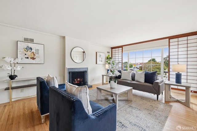 1285 Holloway Ave, San Francisco, CA 94132 - living room featuring a brick fireplace and light wood-style floors