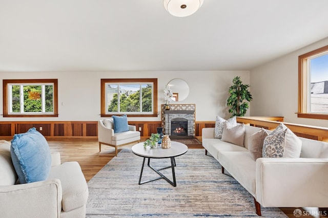 1285 Holloway Ave, San Francisco, CA 94132 - living room featuring wood finished floors, wainscoting, and a fireplace