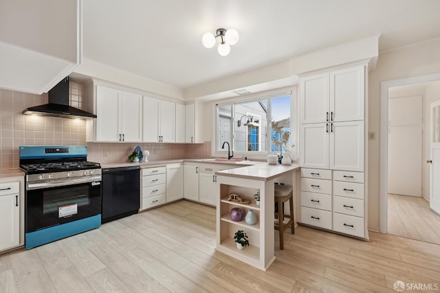 1285 Holloway Ave, San Francisco, CA 94132 - kitchen with stainless steel gas range, wall chimney exhaust hood, black dishwasher, light wood-type flooring, and tasteful backsplash