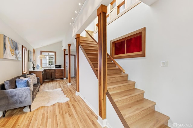 1285 Holloway Ave, San Francisco, CA 94132 - stairs with wood finished floors and vaulted ceiling