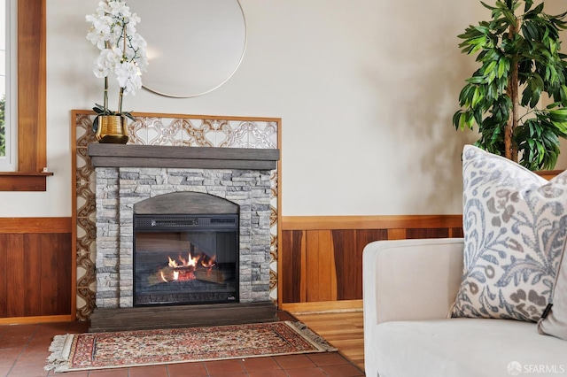 1285 Holloway Ave, San Francisco, CA 94132 - living room featuring a wainscoted wall, wooden walls, tile patterned floors, and a fireplace