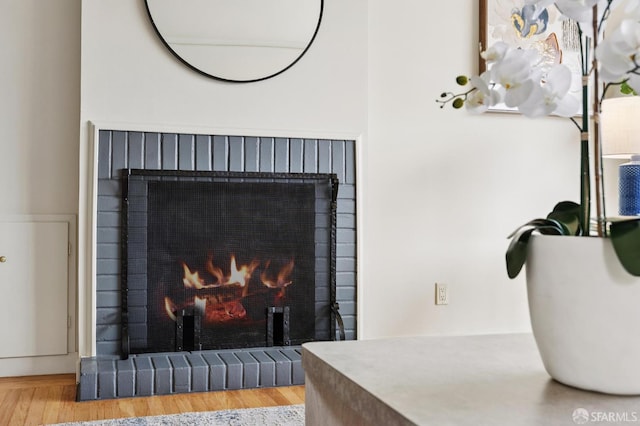 1285 Holloway Ave, San Francisco, CA 94132 - detailed view of a brick fireplace and wood finished floors