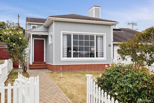 1285 Holloway Ave, San Francisco, CA 94132 - view of front of house with entry steps, a shingled roof, and a chimney