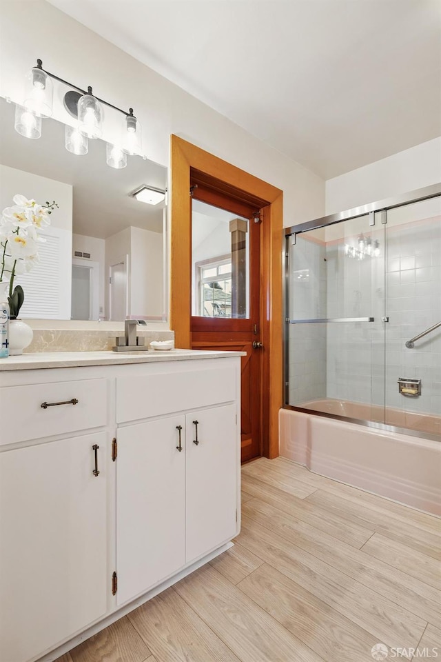 1285 Holloway Ave, San Francisco, CA 94132 - full bath with vanity, shower / bath combination with glass door, and wood finished floors