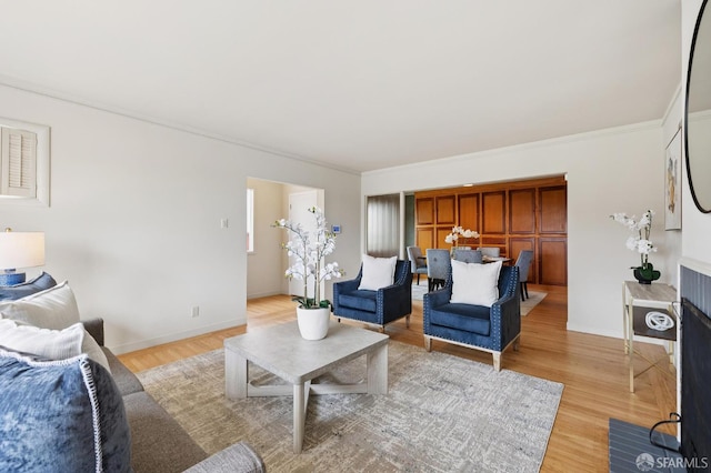 1285 Holloway Ave, San Francisco, CA 94132 - living room featuring light wood finished floors and crown molding