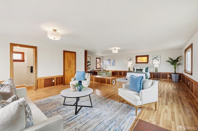 1285 Holloway Ave, San Francisco, CA 94132 - living room featuring a wainscoted wall, wooden walls, and light wood-style flooring
