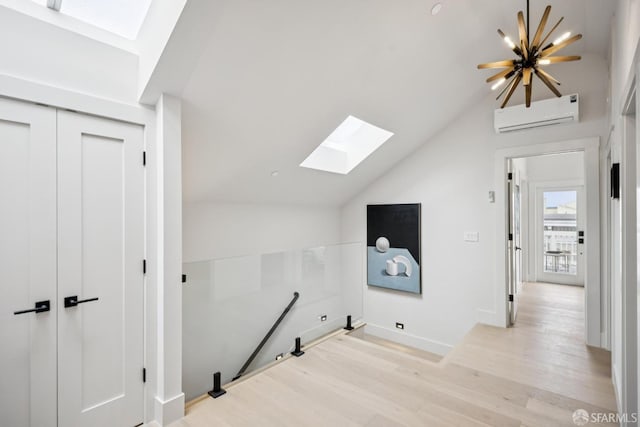 102 Baker St Unit A, San Francisco, CA 94117 - additional living space with a skylight, light wood-type flooring, lofted ceiling, and a wall mounted AC