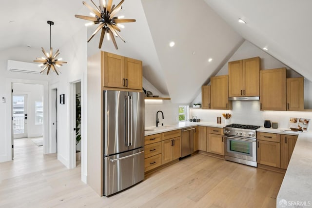102 Baker St Unit A, San Francisco, CA 94117 - kitchen with stainless steel appliances, lofted ceiling, a chandelier, backsplash, and light countertops