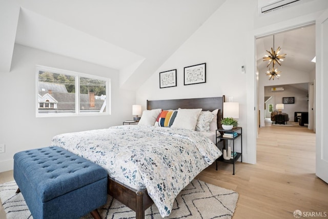 102 Baker St Unit A, San Francisco, CA 94117 - bedroom with vaulted ceiling, wood finished floors, and an AC wall unit