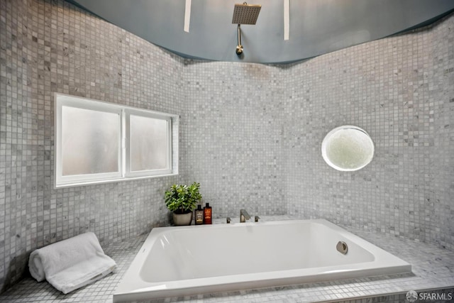 102 Baker St Unit A, San Francisco, CA 94117 - bathroom featuring tiled bath and tile walls