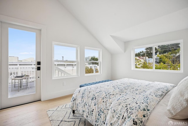 102 Baker St Unit A, San Francisco, CA 94117 - bedroom with light wood-style flooring, access to outside, and vaulted ceiling