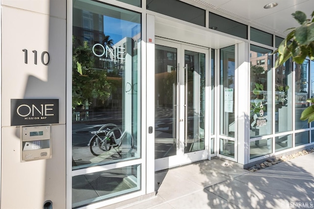 view of exterior entry featuring french doors