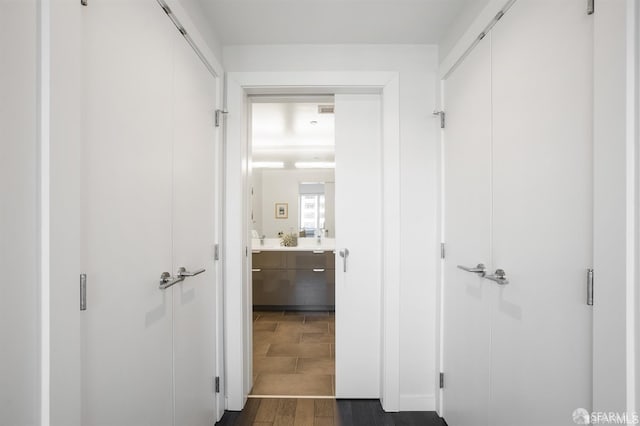 hall featuring dark wood-style flooring