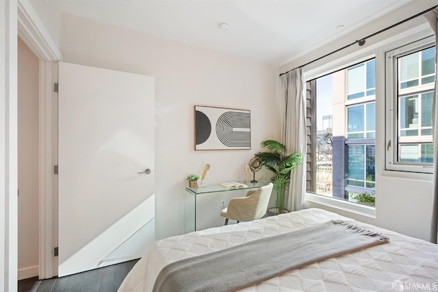 bedroom featuring wood finished floors