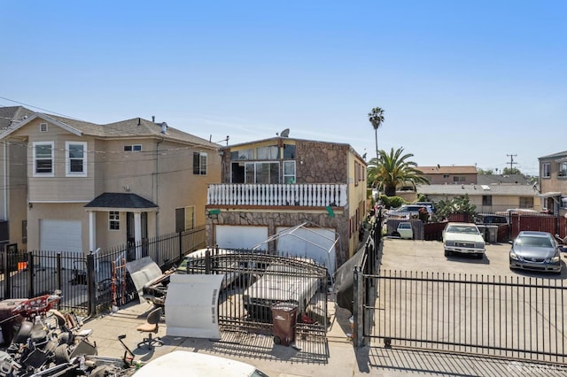 7115 Herbert Guice Way, Oakland, CA 94621 - exterior space with a residential view, a fenced front yard, and an attached garage