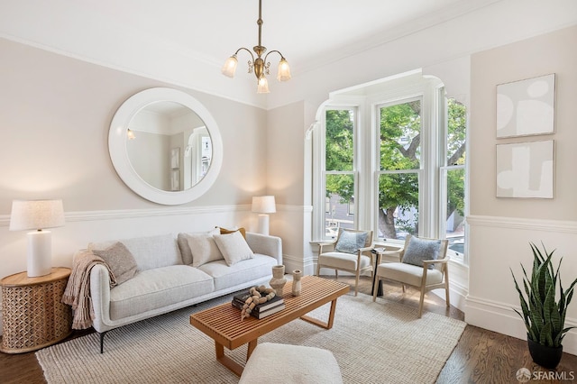 1908 Buchanan St, San Francisco, CA 94115 - living room featuring healthy amount of natural light, a chandelier, a wainscoted wall, dark wood-style flooring, and crown molding
