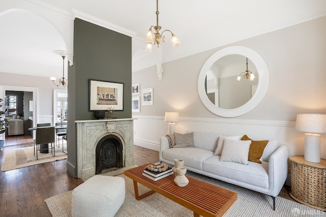 1908 Buchanan St, San Francisco, CA 94115 - living room with a chandelier, dark wood-style floors, and crown molding