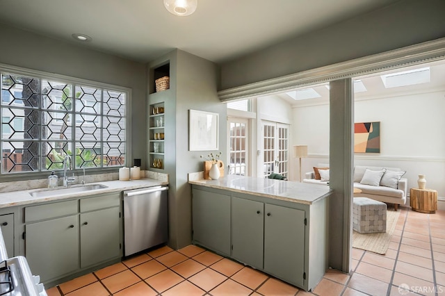 1908 Buchanan St, San Francisco, CA 94115 - kitchen with stainless steel dishwasher and light tile patterned floors