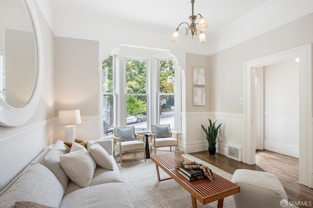1908 Buchanan St, San Francisco, CA 94115 - living room featuring wood finished floors, a chandelier, and ornamental molding