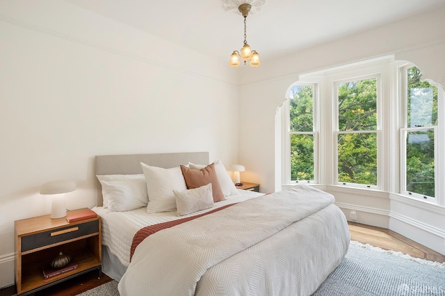 1908 Buchanan St, San Francisco, CA 94115 - bedroom featuring wood finished floors and a chandelier
