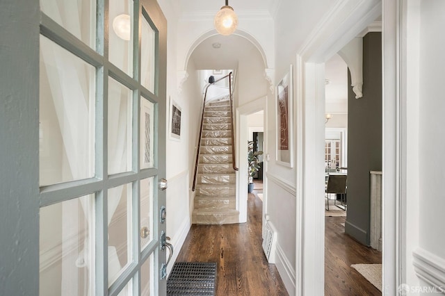 1908 Buchanan St, San Francisco, CA 94115 - hallway featuring arched walkways, stairs, dark wood-style floors, and ornamental molding