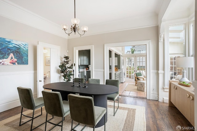 1908 Buchanan St, San Francisco, CA 94115 - dining room with a chandelier, wood finished floors, and crown molding
