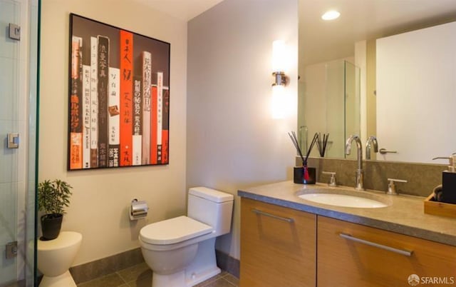 301 Mission St Unit 20E, San Francisco, CA 94105 - bathroom featuring vanity, a stall shower, tile patterned floors, and recessed lighting