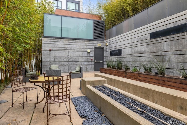 view of patio / terrace featuring a fire pit