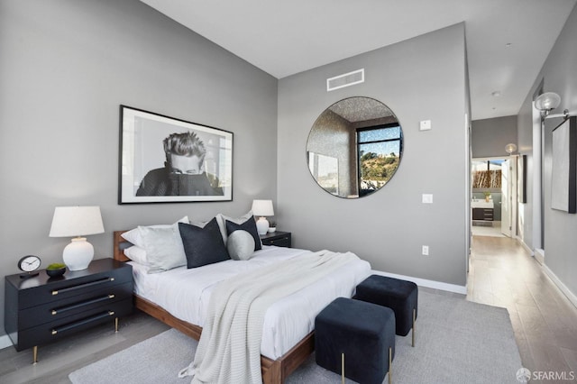 bedroom with light hardwood / wood-style floors