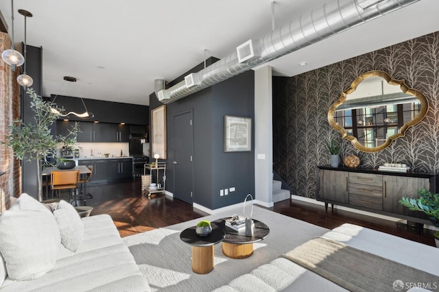 living room with dark hardwood / wood-style floors