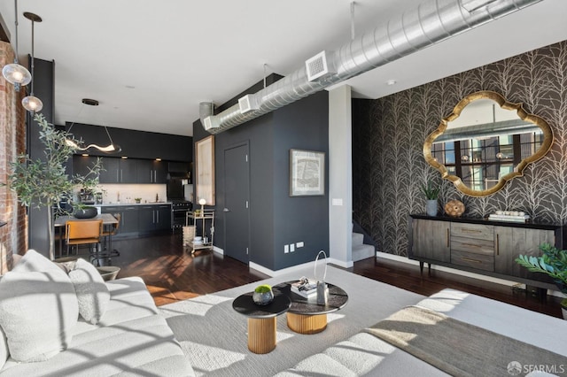 living room with dark hardwood / wood-style flooring