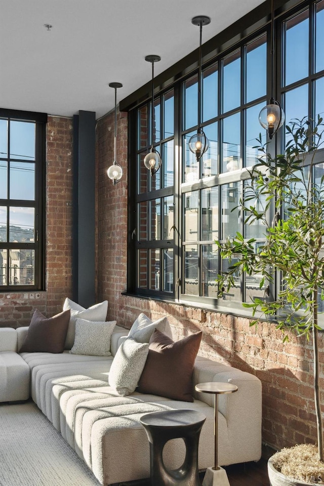 living room with brick wall