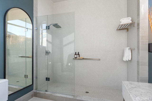 bathroom featuring an enclosed shower