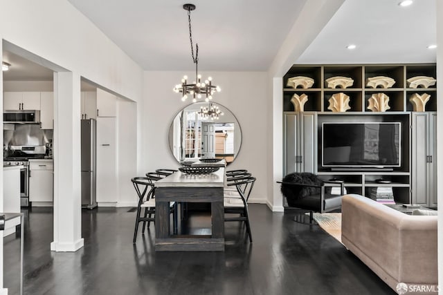 dining space featuring a notable chandelier and dark hardwood / wood-style floors